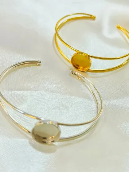 Our simple and elegant bracelet kadas are available in both gold and silver. They provide a classic, adjustable base that is perfect for a central resin art piece.