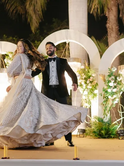 The bride's twirl is always a highlight. We incorporate elegant moves like this to add grace and drama to your first dance.