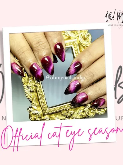 It's officially cat eye season. This design features a deep purple and black cat eye effect, creating a mysterious and glamorous look perfect for the winter months.