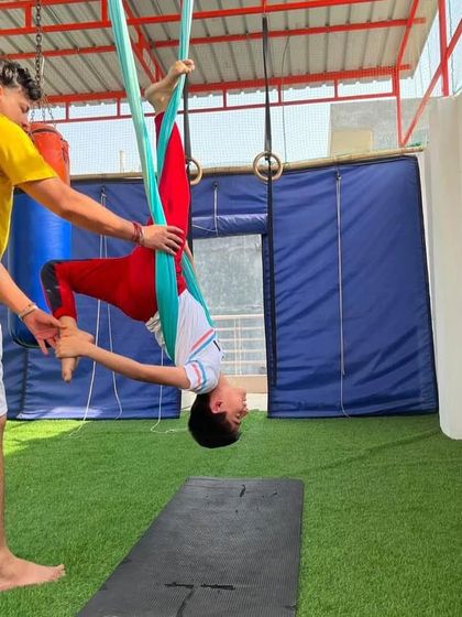 A moment of one-on-one instruction. I make sure every child feels supported and confident as they learn new poses and movements.