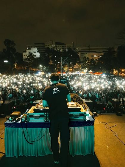Another perspective of the phone-light moment, showing the sheer size of the audience.
