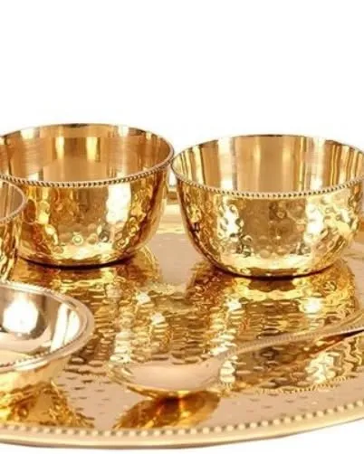 I use high-quality, traditional hammered brassware for serving, adding an authentic and royal touch to the dining experience.