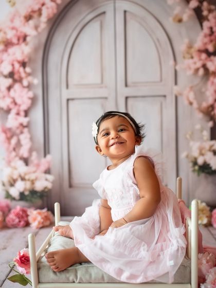 The biggest, happiest grin! It's so rewarding to see these little ones grow, especially when I photographed her older brother at the same age.