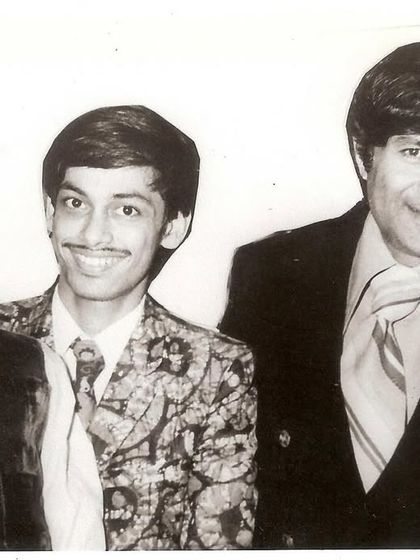 A vintage photo of my father, Ramdas Padhye, with the legendary actor Dev Anand and our 100-year-old puppet, Ardhavatrao.