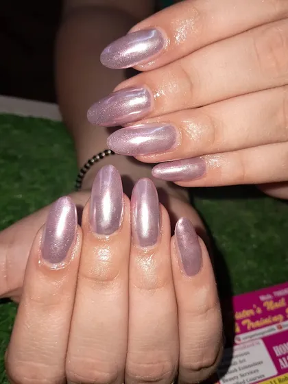 A full set of beautiful, long almond nails with a soft pink chrome finish.