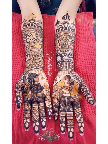 The complete bridal mehendi for Akshata, showcasing the beautiful bride and groom portraits, along with symbols of their journey like the wedding date and sacred fire.