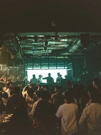 A wide shot showing the scale of the crowd at Club Illusions. Even in a dark and moody setting, the energy is palpable.