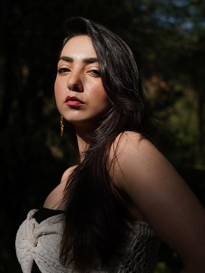 A stunning close-up portrait with a sliver of sunlight hitting my face, highlighting my features.