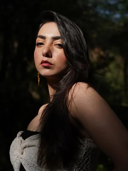 A stunning close-up portrait with a sliver of sunlight hitting my face, highlighting my features.