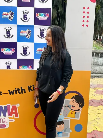 A happy, candid moment after successfully choreographing and managing the Kidzonia Preschool Annual Day. Working with kids is always a joy.