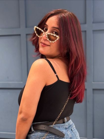 A playful shot showing off the vibrant tones of this red hair colour.