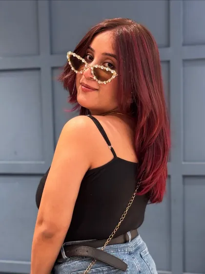 A playful shot showing off the vibrant tones of this red hair colour.