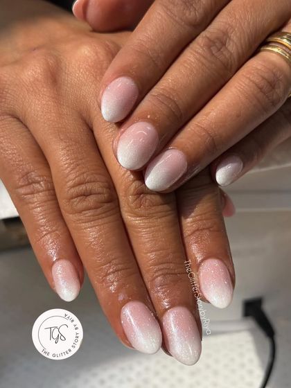 A soft and delicate baby boomer or ombre nail set. The seamless blend from a natural pink base to a soft white tip is timeless and elegant.