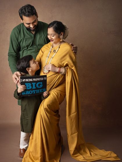 "I am being promoted to Big Brother!" This is such a sweet way to include the older sibling in the maternity announcement, capturing his excitement for the new arrival.