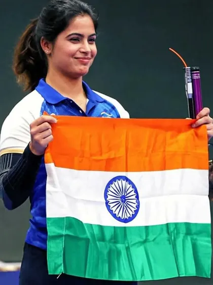 Manu Bhaker proudly holding the Indian tricolor after her historic bronze medal win at the Paris 2024 Olympics. Moments like these are the culmination of our dedicated Olympic shooting training program.