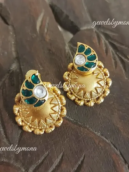Another design from my Dakshinaya collection, these studs feature a simple yet elegant design with green enamel work on a textured gold base, perfect for everyday traditional wear.