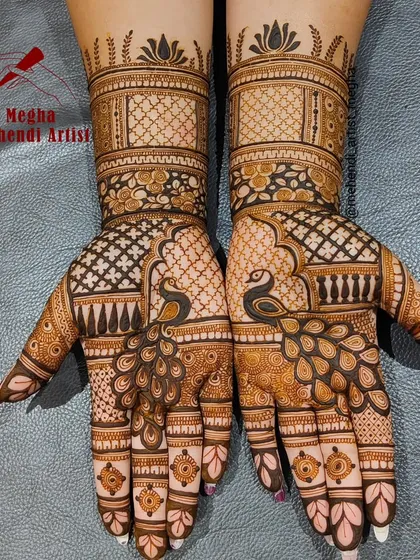 The peacock is a timeless symbol of grace and beauty in Indian weddings. I love making it the centerpiece of a design, with its detailed feathers flowing across the hand, surrounded by delicate floral and geometric patterns.