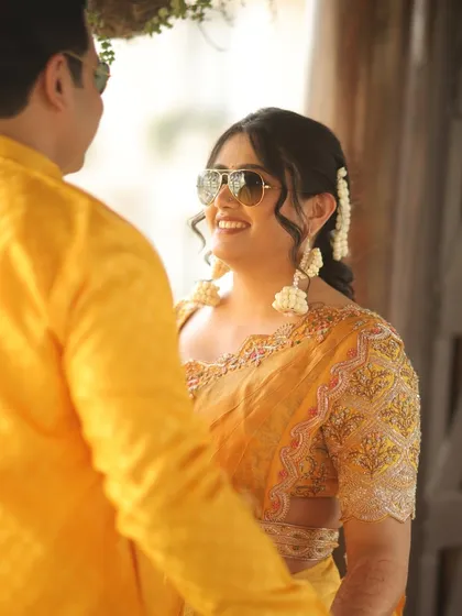 A sweet, candid moment between the couple, their smiles and loving gaze captured perfectly.