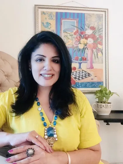 A portrait showing the statement agate and blue stone necklace I paired with the yellow linen dress.