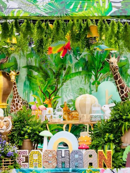 A wide view of Eshaan's incredibly detailed safari setup. This image captures the sheer scale and immersion of the theme, with a ceiling of hanging greenery, numerous animal props, and custom name blocks.