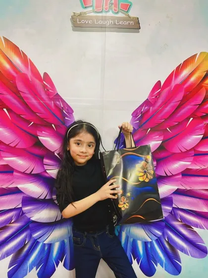 This little angel earned her wings and a special gift for her amazing work in the hula hoop class.