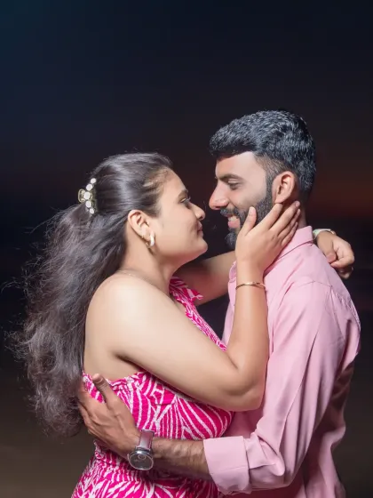 A candid moment of love and affection between the couple on the beach. Our pre-wedding photography aims to capture the natural chemistry and connection you share.