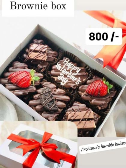 My Valentine's Day brownie box is perfect for sharing with your loved one. It includes fudgy brownies decorated with chocolate-dipped strawberries, KitKat pieces, and a 'Happy Valentine's Day' message.