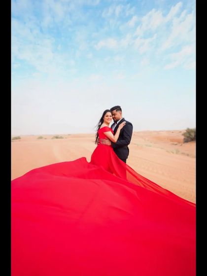 A romantic moment captured in the Dubai desert. We pride ourselves on being a key part of our NRI clients' wedding journey, from planning to the final performance.