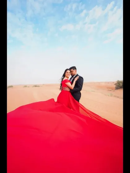 A romantic moment captured in the Dubai desert. We pride ourselves on being a key part of our NRI clients' wedding journey, from planning to the final performance.