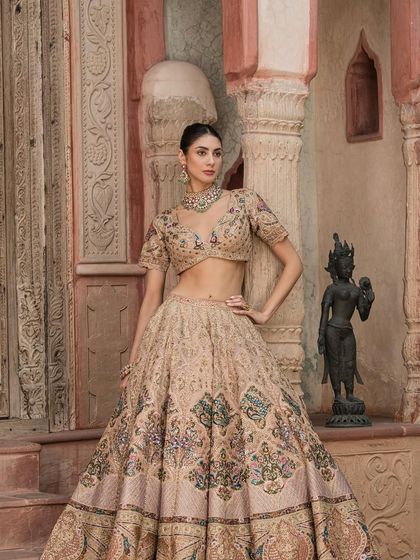 From our "Bridal Saga" collection, this pastel lehenga with multi-color threadwork is perfect for the modern bride. We bring your dream bridal dress to reality.