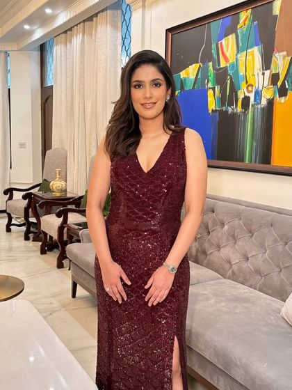 Nandini celebrating her anniversary in style. A deep burgundy sequin dress paired with a soft, glamorous makeup look is a perfect combination for a special night out.