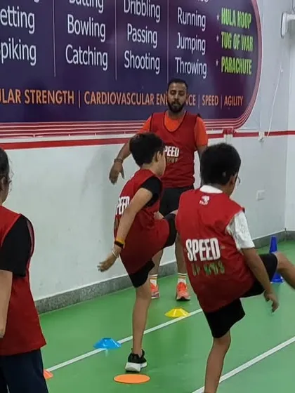 High-knee drills are excellent for improving running form and coordination. Our coaches guide the kids to ensure they are doing the movements correctly.