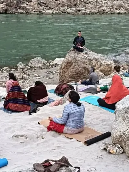 Our students find their focus during a meditation session by the river. The natural sounds and fresh air enhance the meditative experience, making it easier to go deeper.
