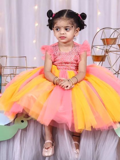 A thrilling 'Hot Wheels' themed birthday party, with checkered flags, car cutouts, and a custom racetrack backdrop, perfect for little speed enthusiasts.