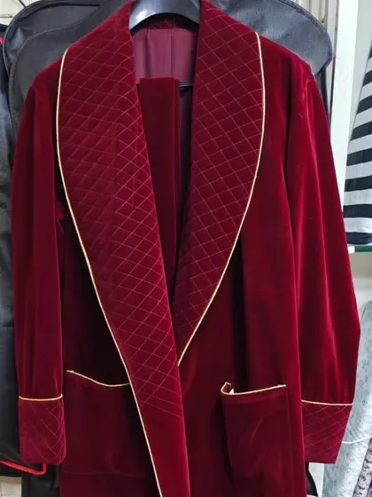 A close-up of the custom-made velvet robe. The quilted detailing on the lapel and the fine gold piping are the small touches that elevate a costume from just clothing to a piece of character art.
