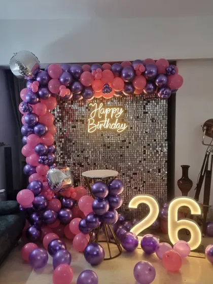 A wide shot of the 26th birthday setup in a living room, demonstrating how we can create a club-like vibe at home.