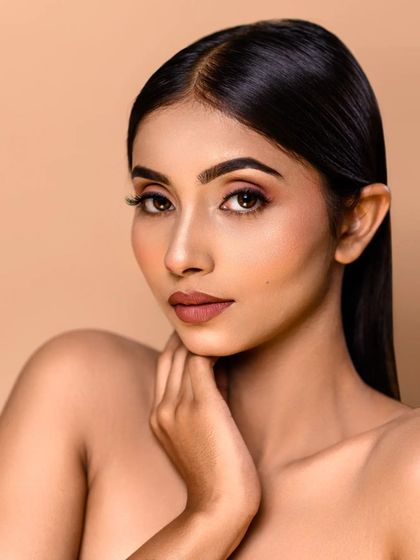 A classic headshot with a focus on the model's natural beauty. The simple lighting and composition make this a versatile shot for an actor or model's portfolio.