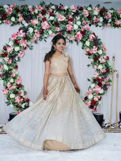 A full-length shot showing her twirling in her shimmery skirt. The makeup and hair are designed to look great from every angle.