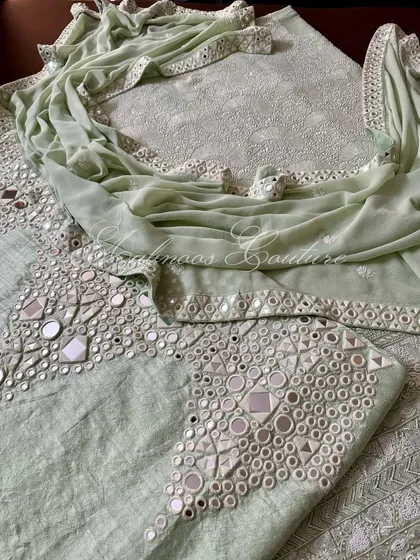 A close-up of the palazzo and kurta, showcasing the different textures of Chikankari and mirrorwork.