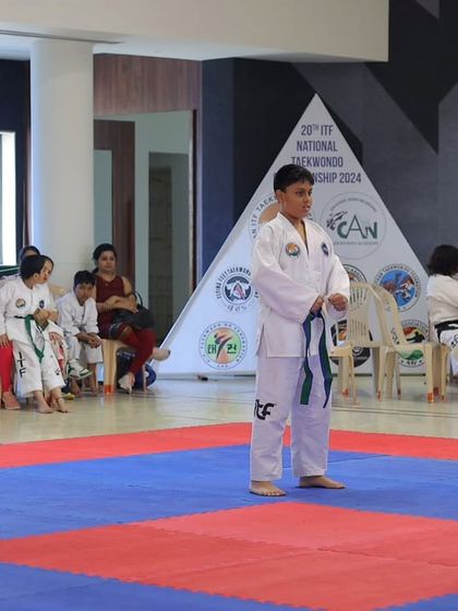 Poised and ready, our students stand at attention before their team pattern (Tul) performance at the 20th National Taekwon-Do Championship.