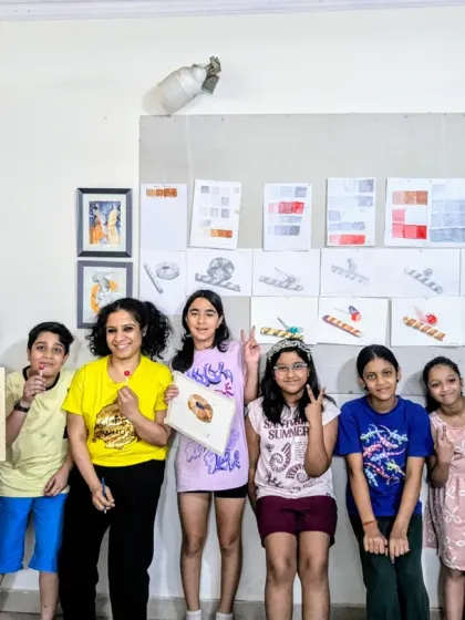 A proud moment for our object study class. The group shows off their detailed sketches and paintings of wafer rolls and lollipops, along with their value study charts.