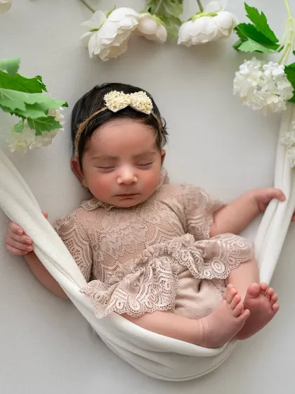 This is the final result of our hammock setup. The baby appears to be peacefully floating among flowers, a beautiful illusion we create using safe, hands-on techniques and a little editing magic.