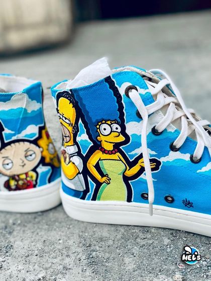 A close-up of our Simpsons and Family Guy mashup sneakers. This shot features Homer and Marge Simpson next to a worried Stewie Griffin.