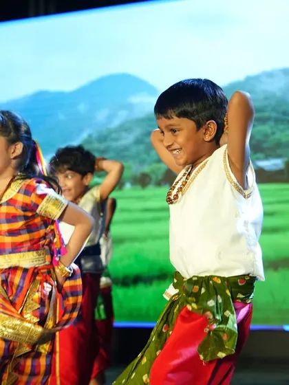 Joy is a core part of our curriculum. This moment from our Annual Day captures the pure happiness and confidence that blossoms on our stage. We believe that celebrating together through dance, music, and performance helps children express themselves and builds a strong, supportive community.