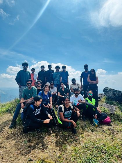 Another group shot from the scenic Kumara Parvatha trek under a clear blue sky.