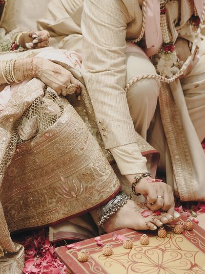 A close-up of the lotus motif embroidered on the bride's lehenga, a detail that tied the entire wedding theme together.