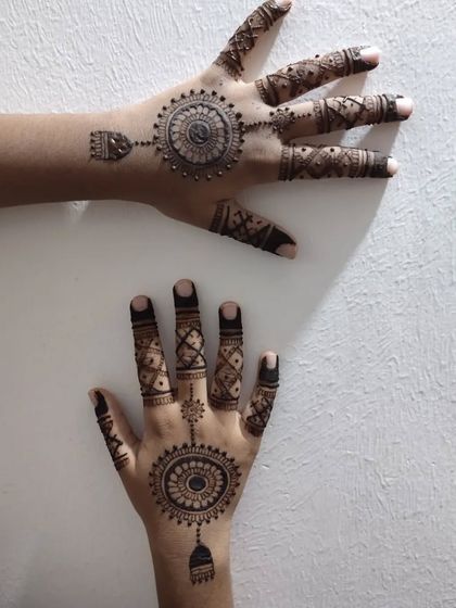 Another view of the child's mandala design, showing both hands.