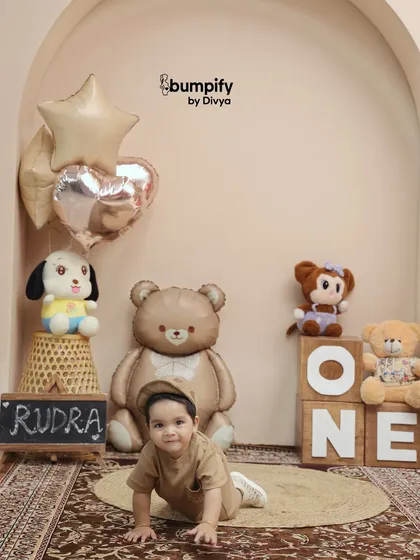 On the move! Capturing a baby crawling is a perfect way to remember this fleeting stage during their first birthday photoshoot.