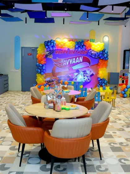 Another view of the Hot Wheels party setup, showing how we arrange both adult and kid-sized tables to accommodate all guests comfortably.