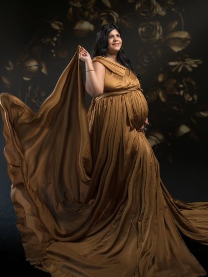 Embracing timeless elegance, this stunning black and white maternity portrait is a blend of classic artistry and modern creativity.